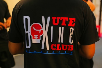 a man wearing a tshirt with a boxing club on it