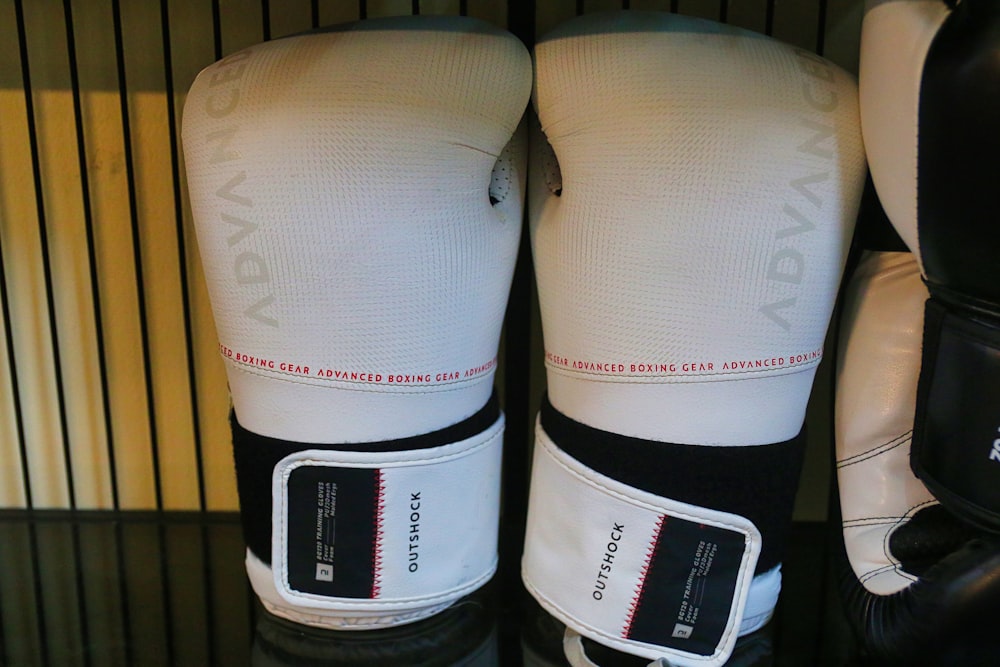 a pair of white and black boxing gloves