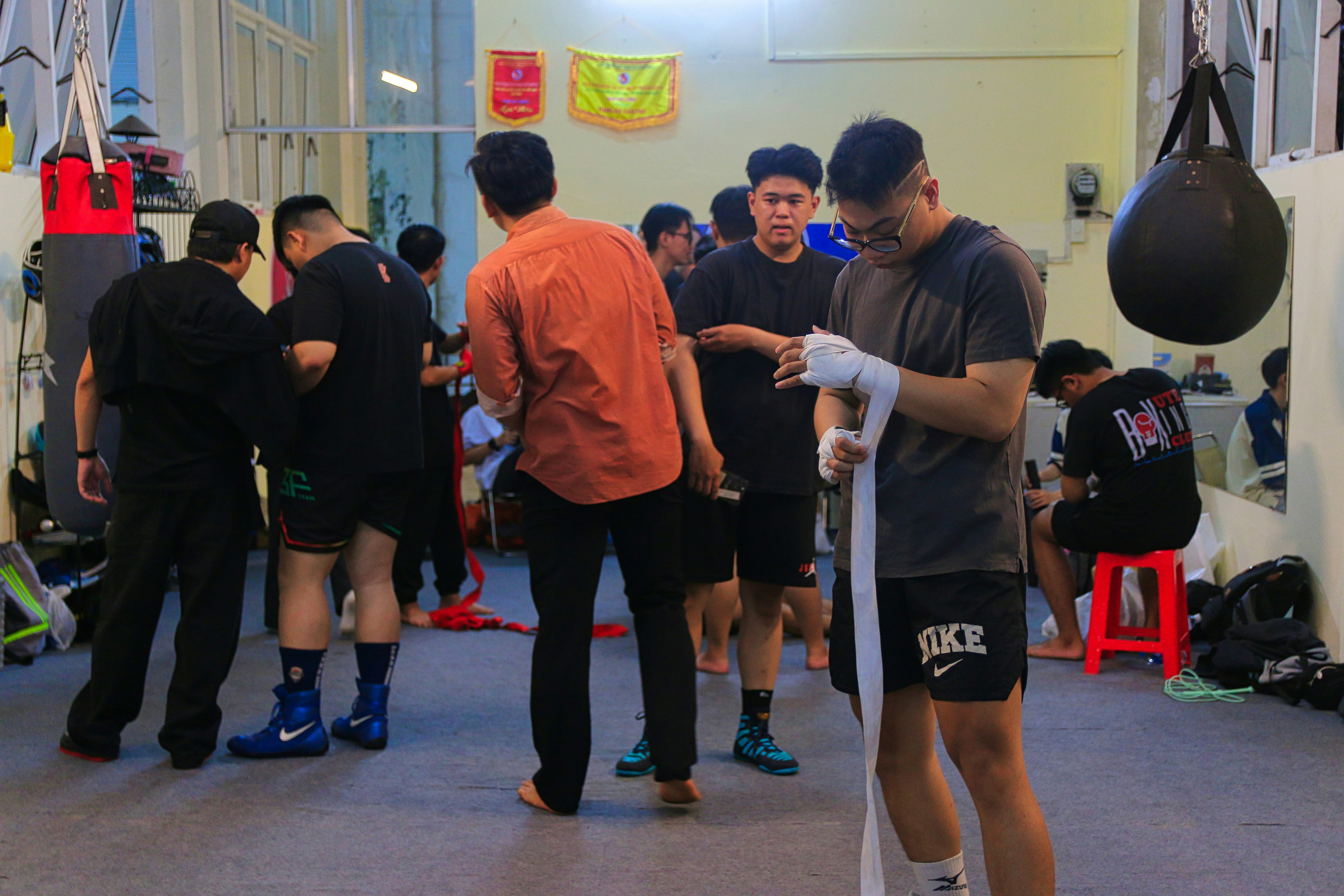 a group of men standing around each other