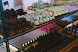 a display case filled with lots of different types of chocolates