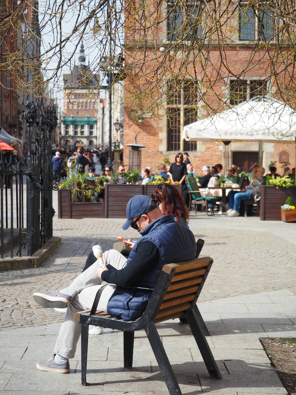 a couple of people sitting on a bench