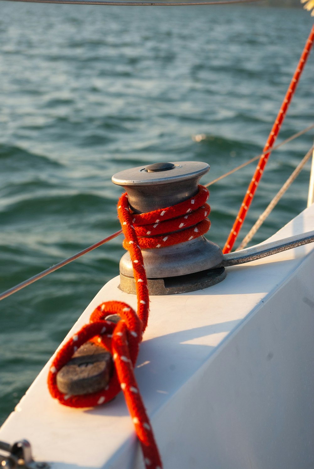 a red rope on the front of a boat