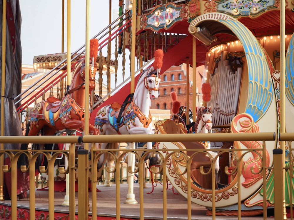 a merry go round at a carnival with horses