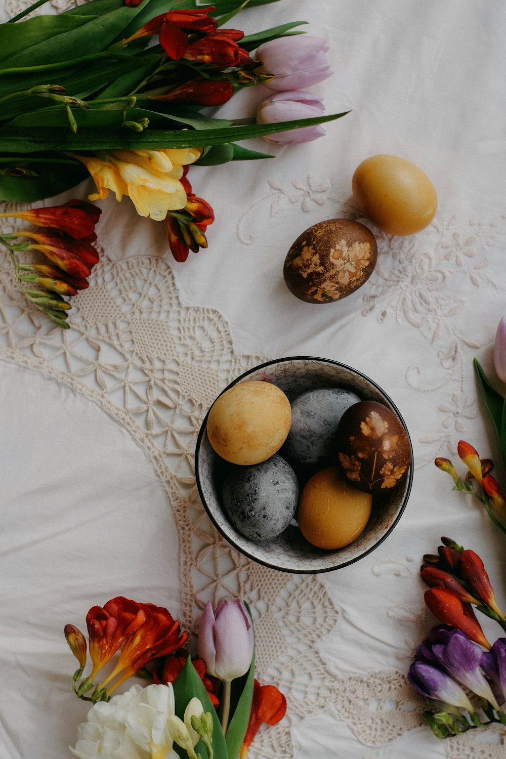 a bowl filled with eggs sitting on top of a table