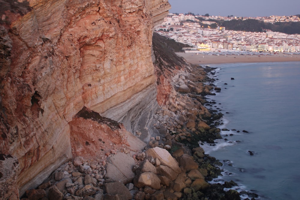 a view of a rocky cliff next to the ocean