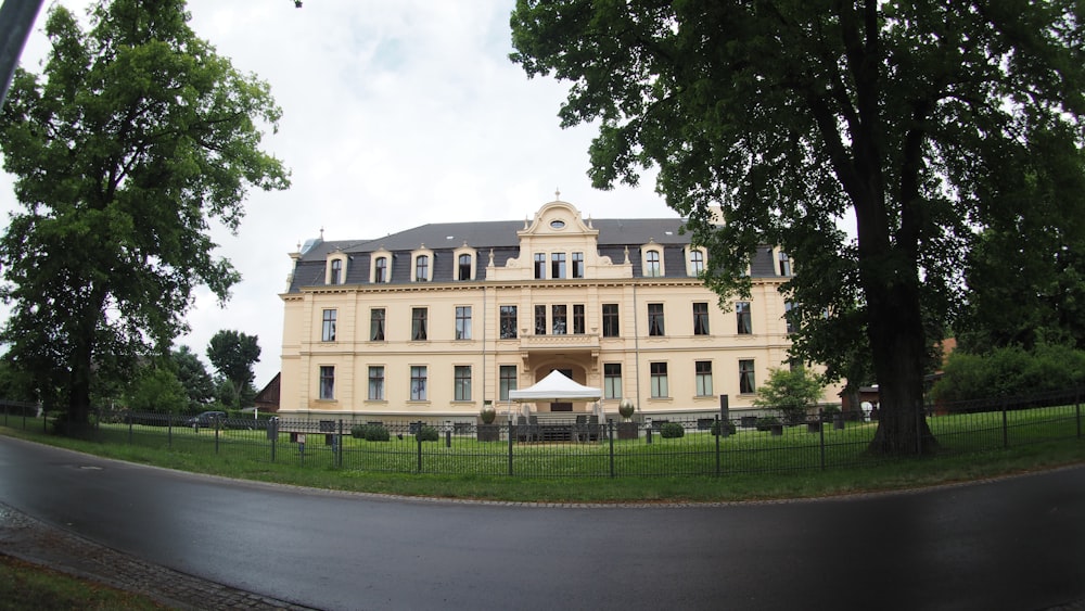 a large building sitting on the side of a road