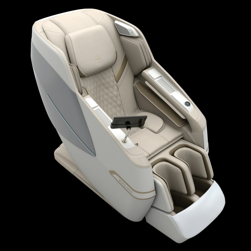 a white and beige airplane seat with a remote control