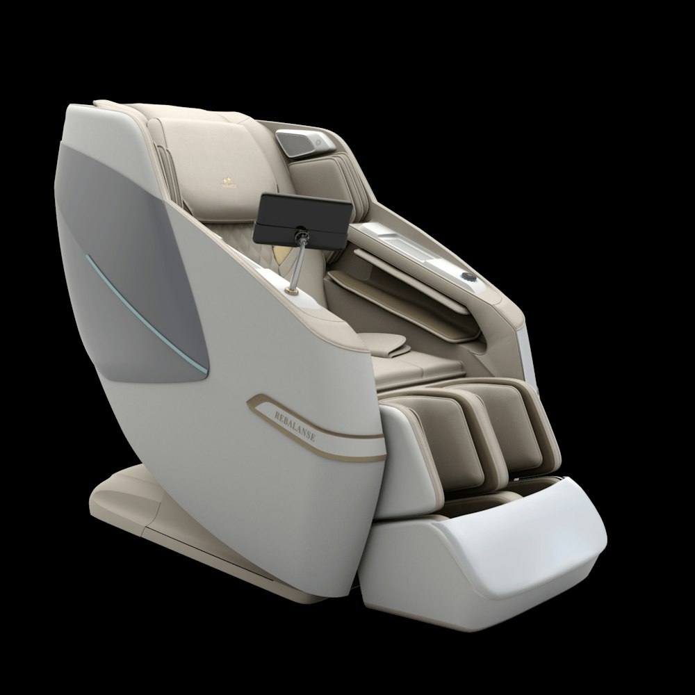 a white and beige massage chair with a black background