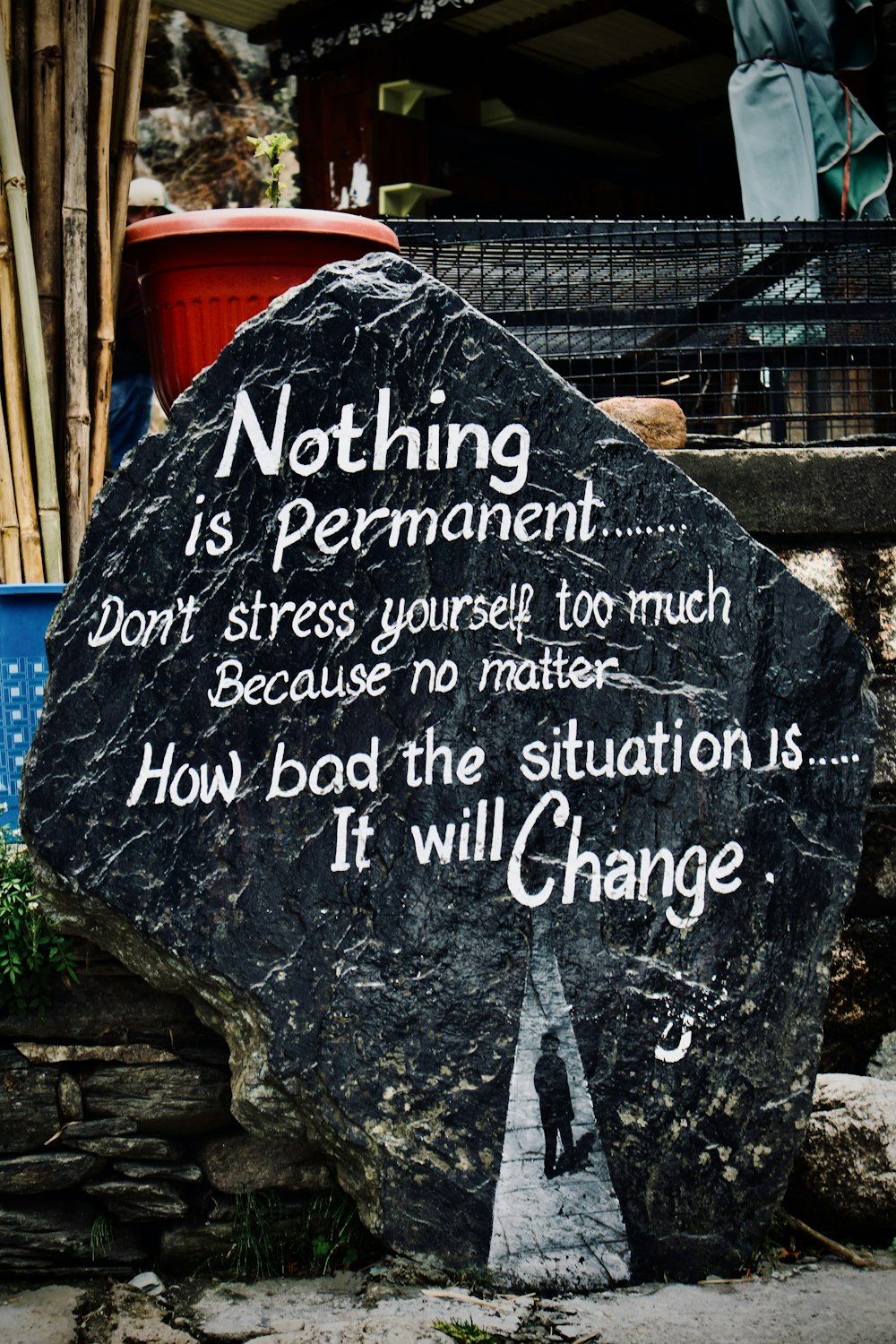 a rock with a quote written on it