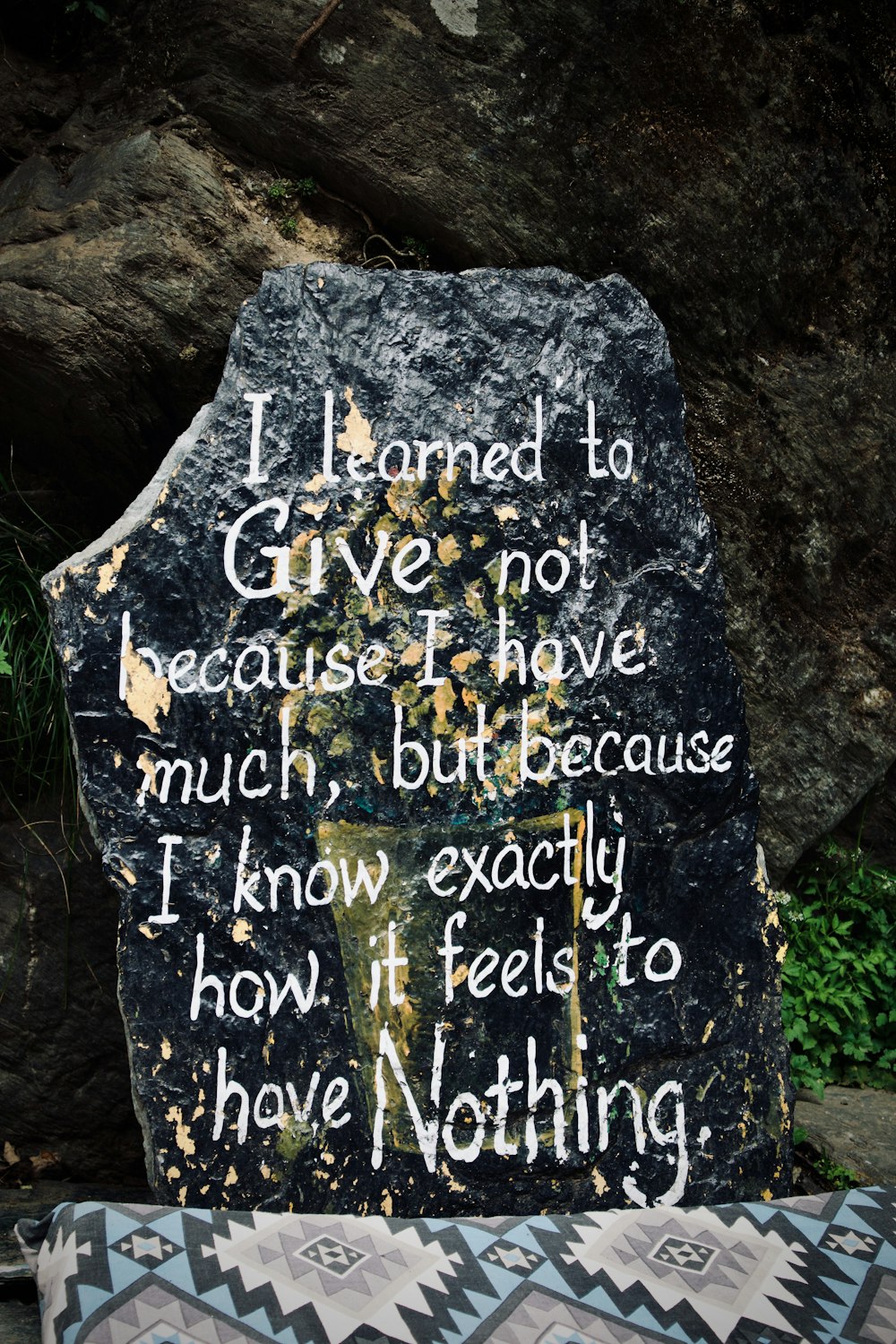 a rock with a poem written on it