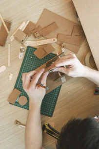 a person working on a project on a table