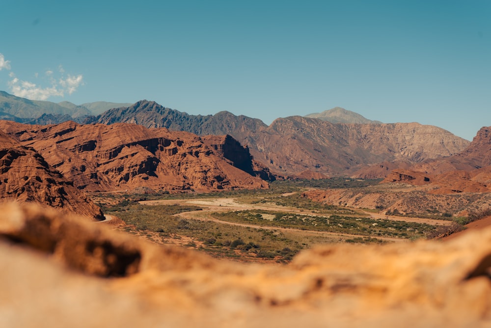 a scenic view of a valley and mountains