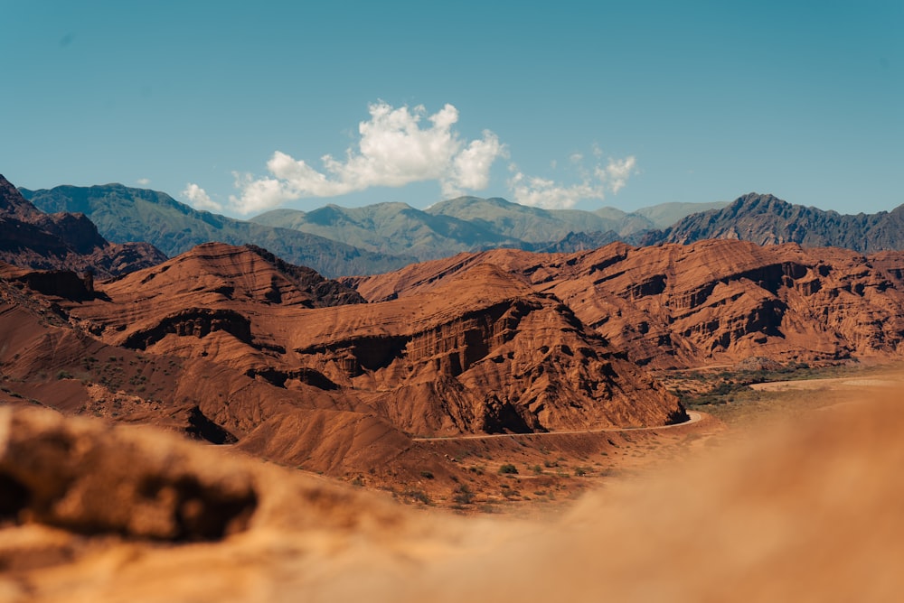 a desert landscape with mountains in the background