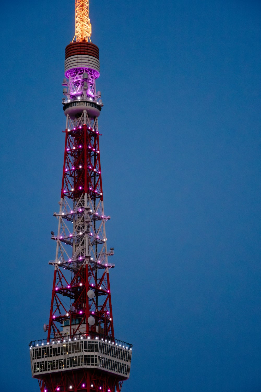 a very tall tower with a clock on it's side