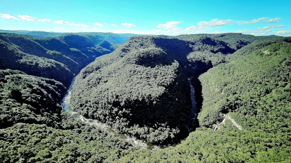 an aerial view of a lush green valley