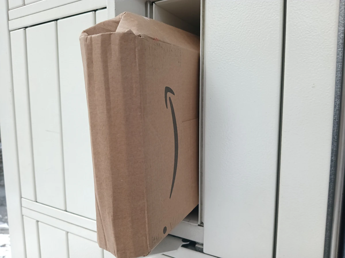 A brown cardboard box with an arrow drawn on it