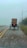 a horse drawn carriage traveling down a road