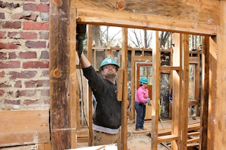 a man standing inside of a house under construction