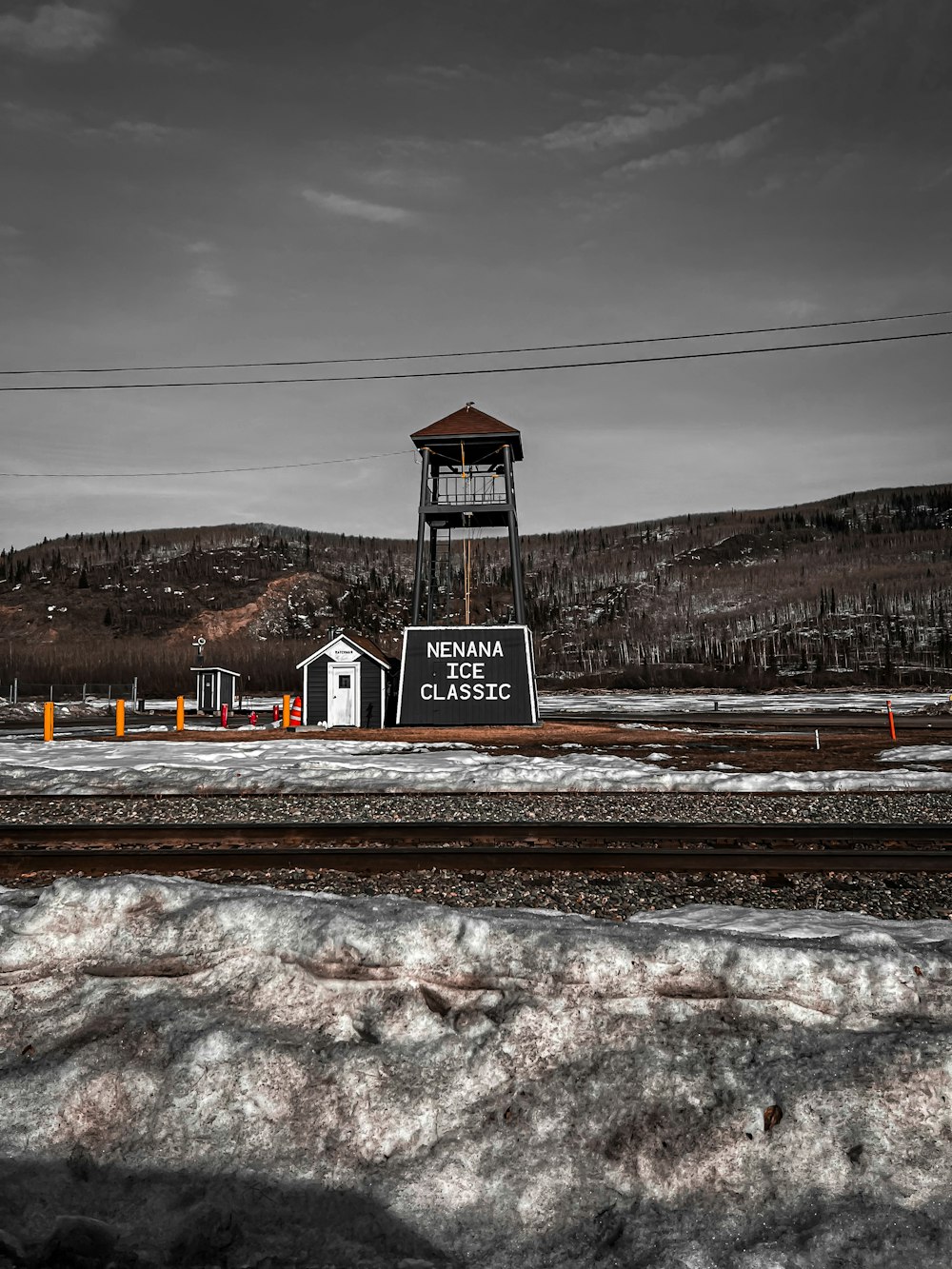 a black and white photo of a water tower