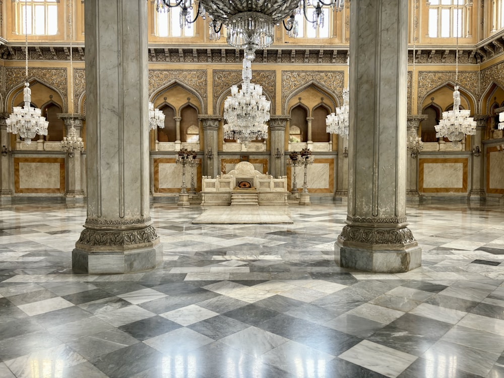 a chandelier hanging from a ceiling in a large room