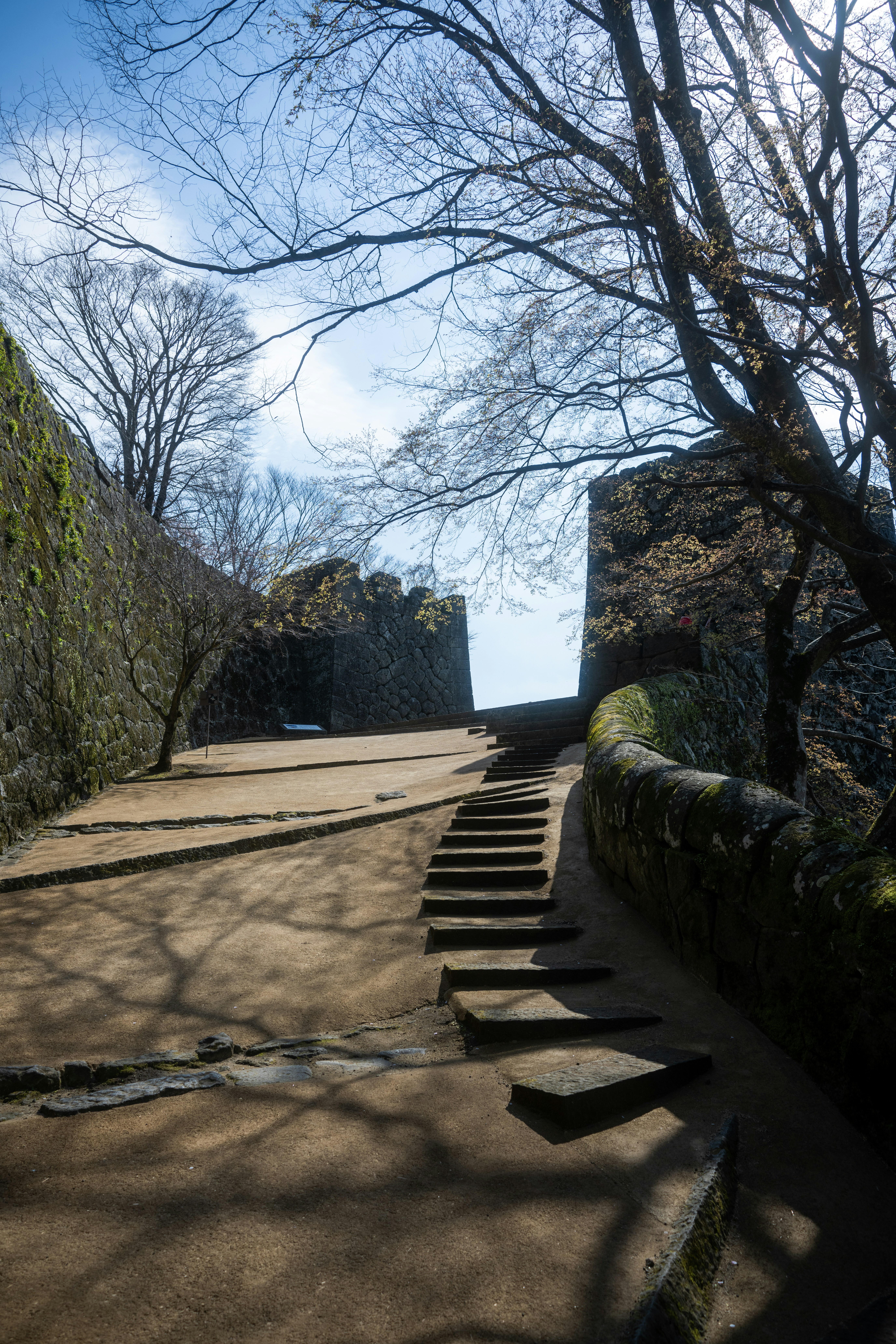 a set of steps leading up to a stone wall