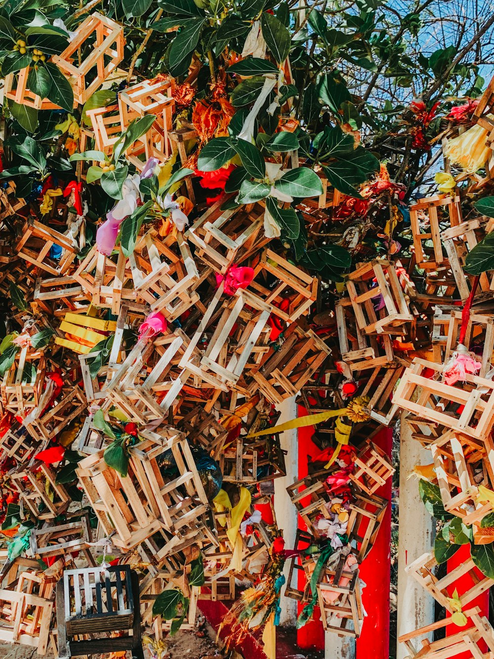 a bunch of pieces of wood hanging from a tree