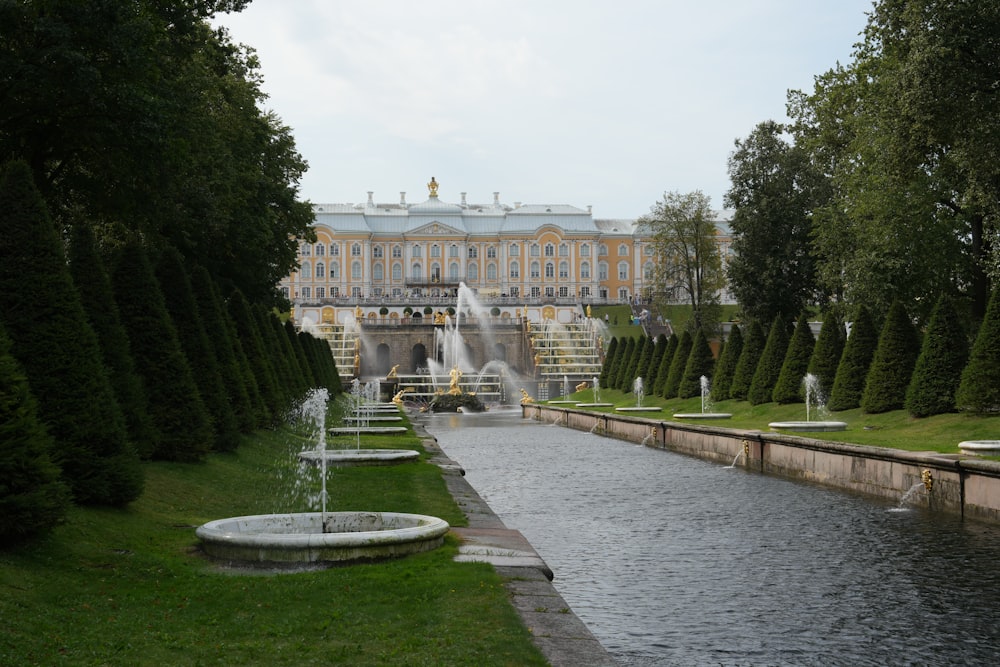 a large building with a fountain in front of it