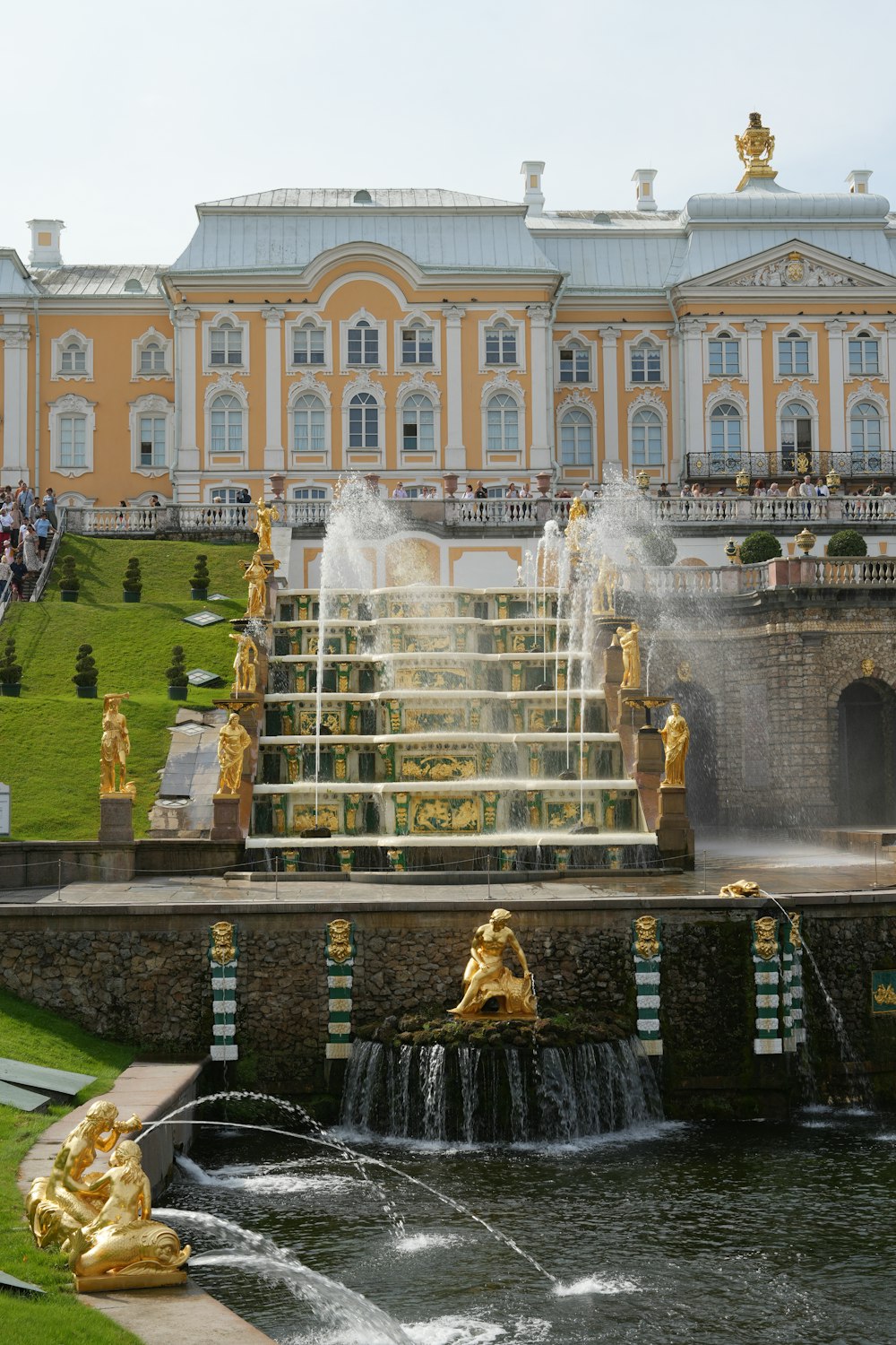 a large building with a fountain in front of it