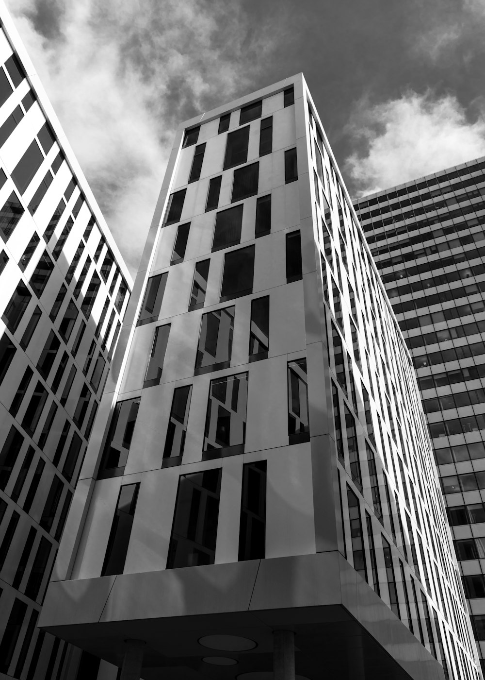 a black and white photo of two tall buildings