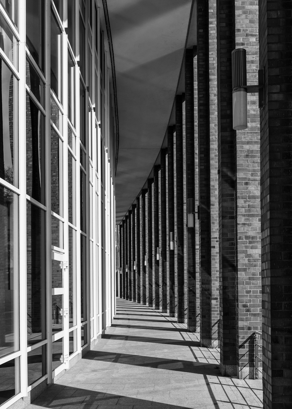 a black and white photo of a row of windows