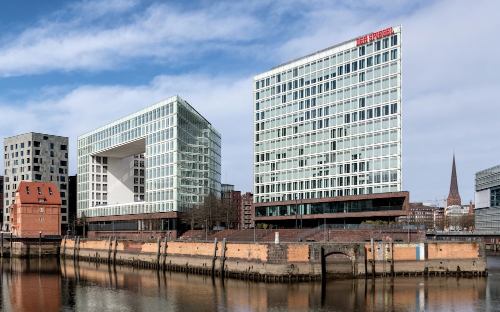 a body of water with buildings in the background