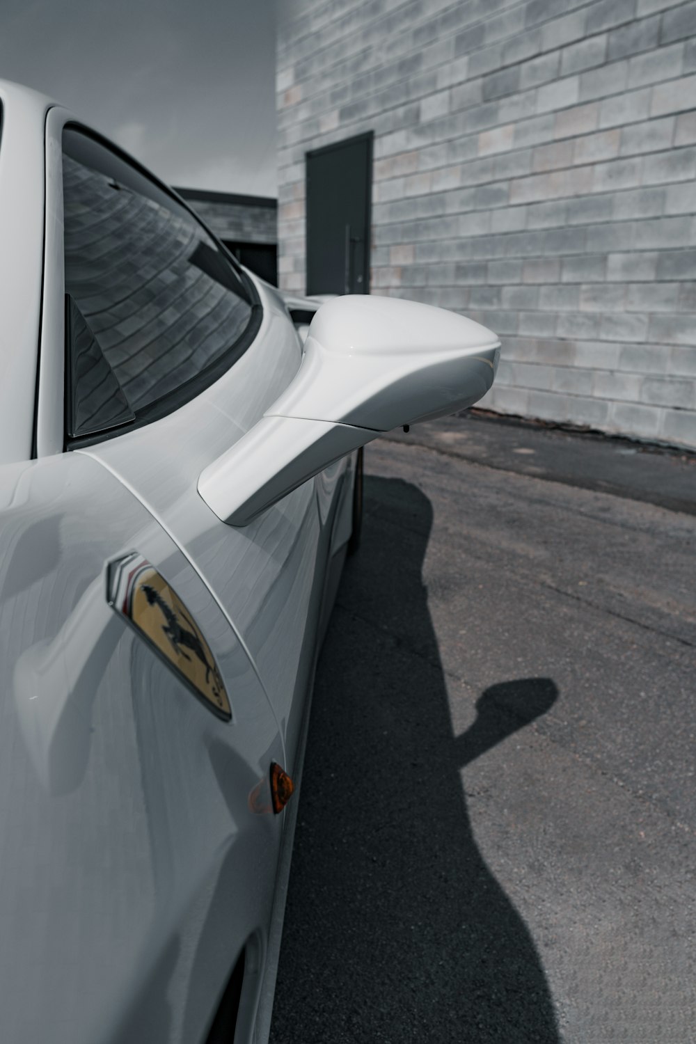 a white car parked in front of a building