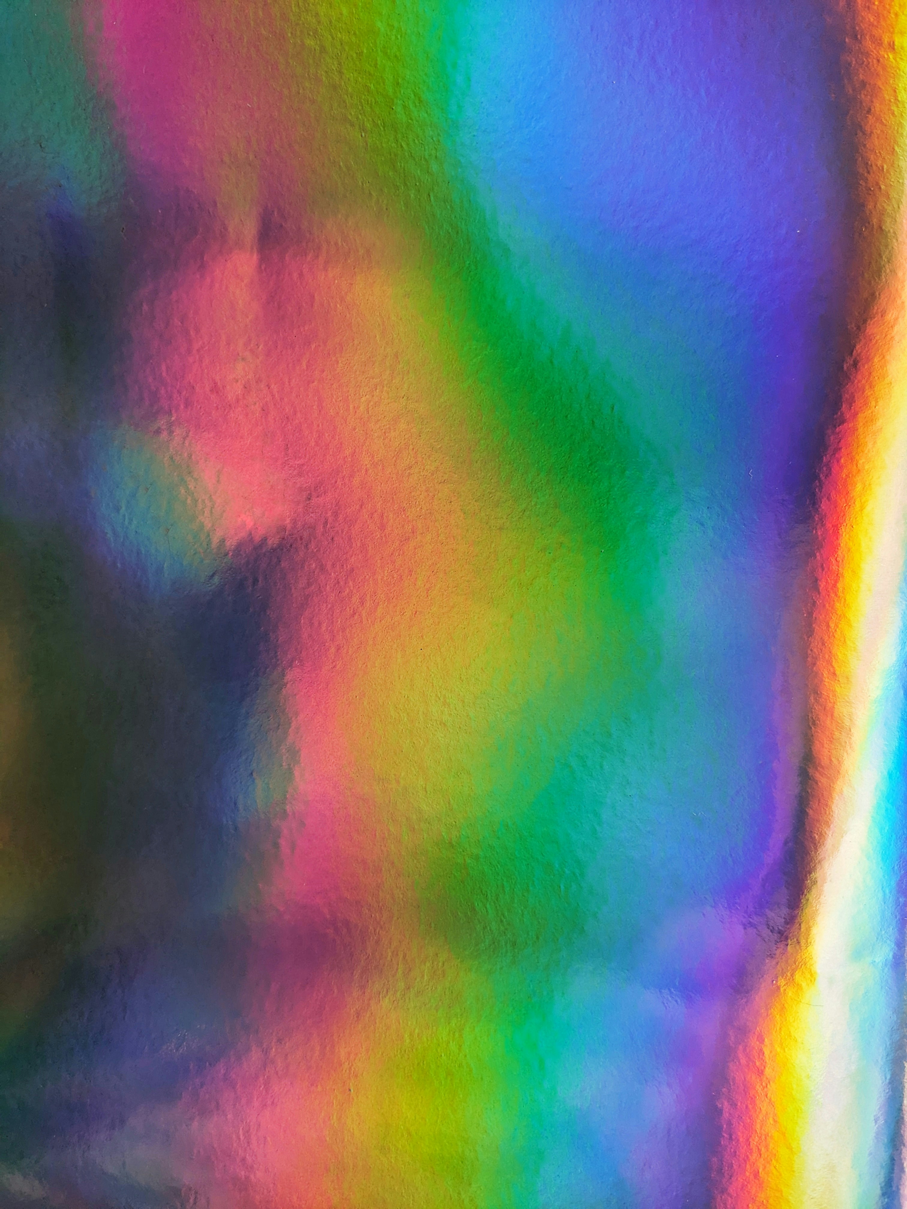 a multicolored image of a vase on a table