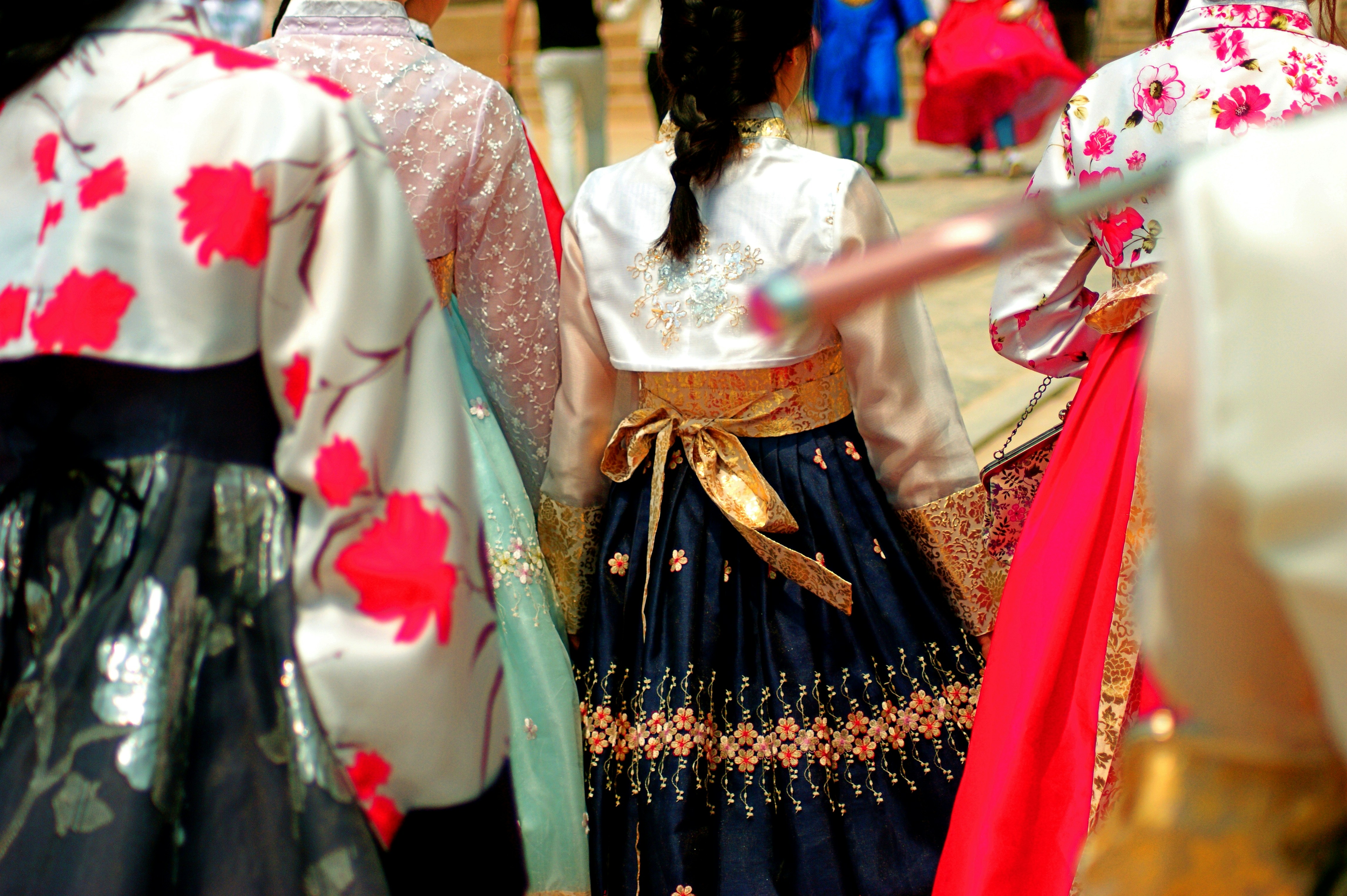 a group of people dressed in traditional japanese clothing