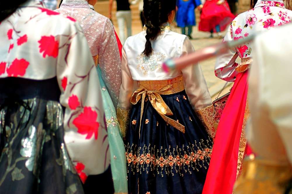 a group of people dressed in traditional japanese clothing