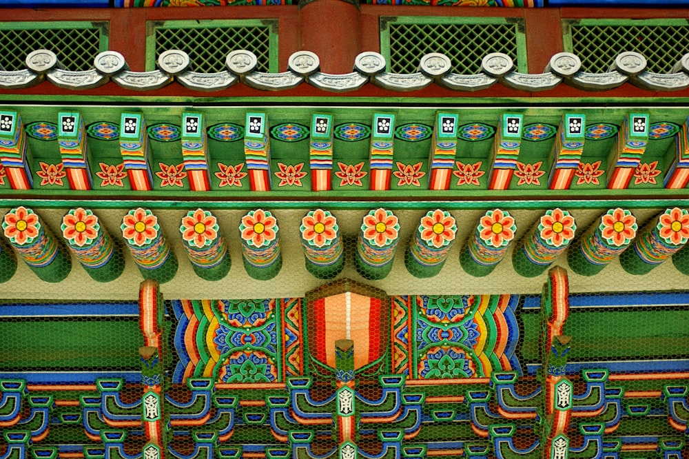 a close up of a building with colorful designs on it