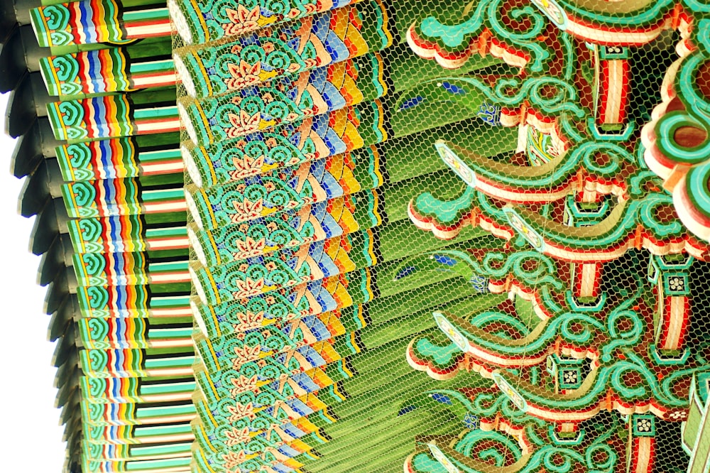 a close up of a building with many designs on it