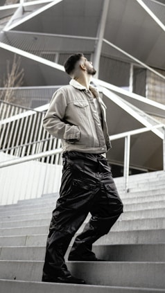 a man standing on some steps in front of a building