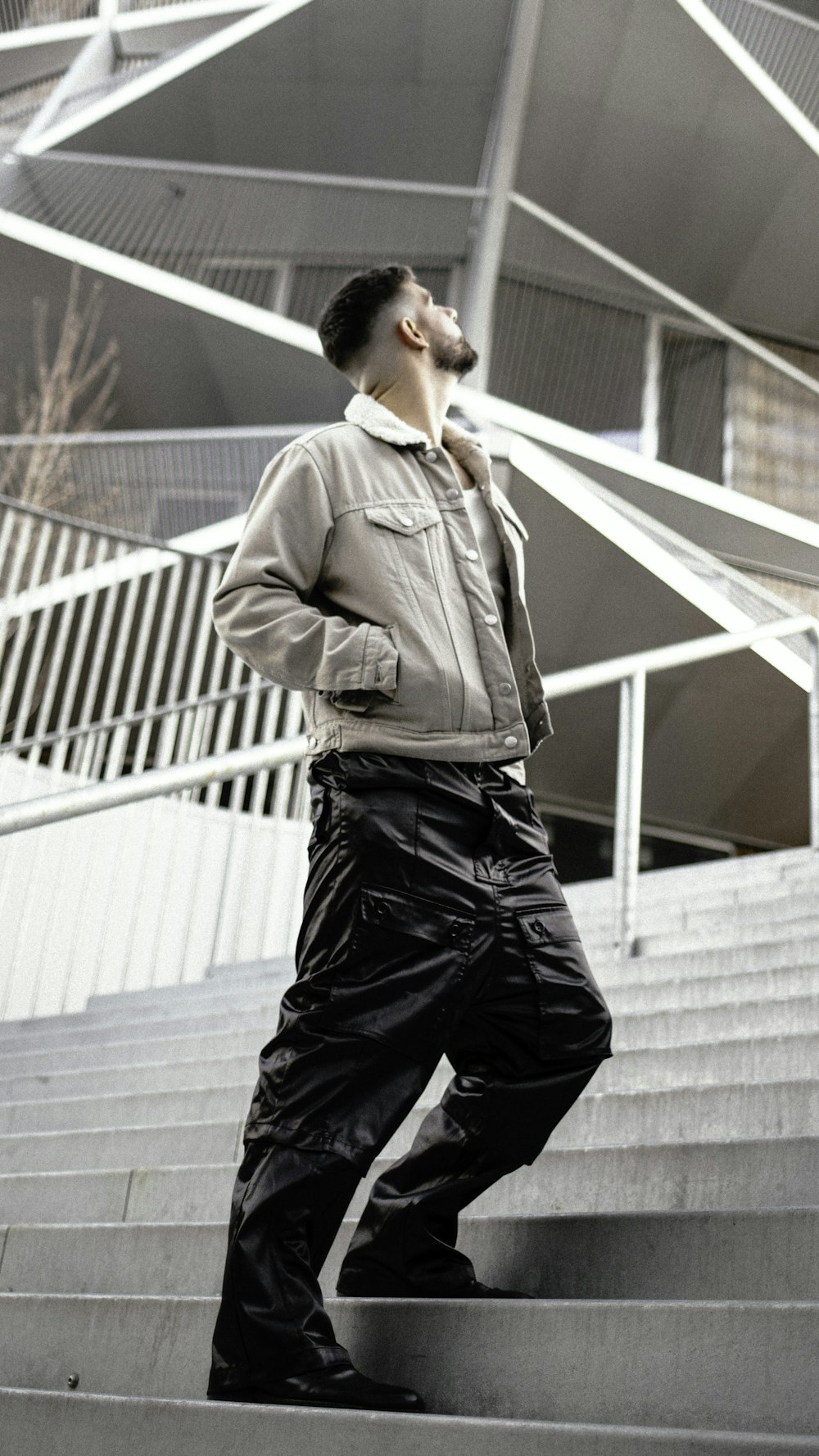 a man standing on some steps in front of a building