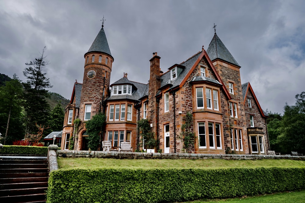 a large brick building with two towers on top of it