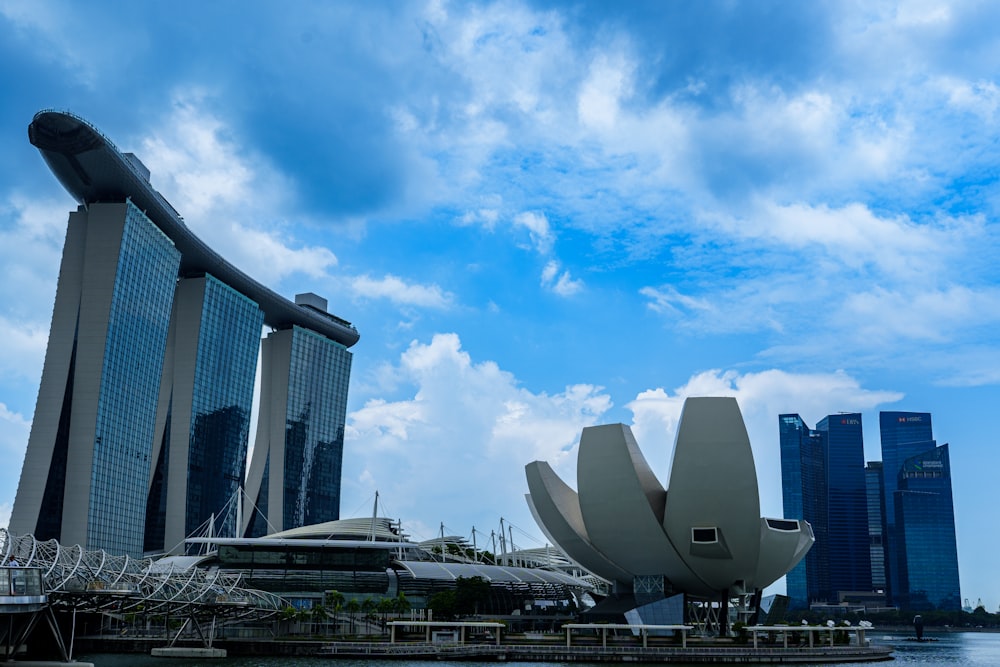 a body of water with a large building in the background