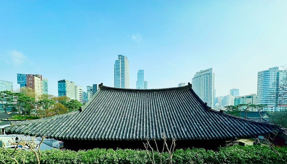 a building in a city with tall buildings in the background