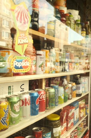 a store filled with lots of different types of soda