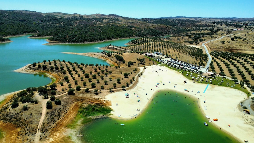 an aerial view of a lake surrounded by trees