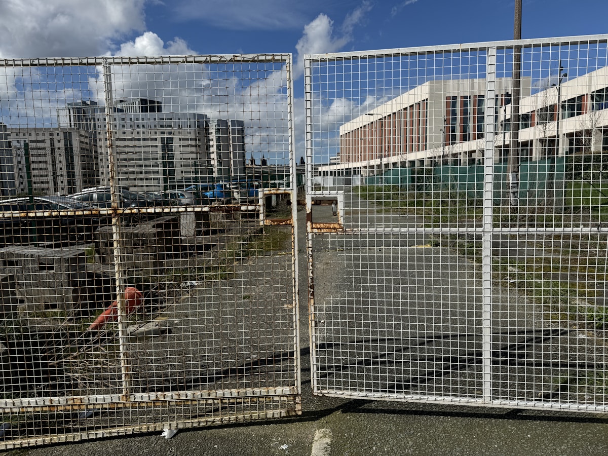 Industrial zone entrance gate with security barrier