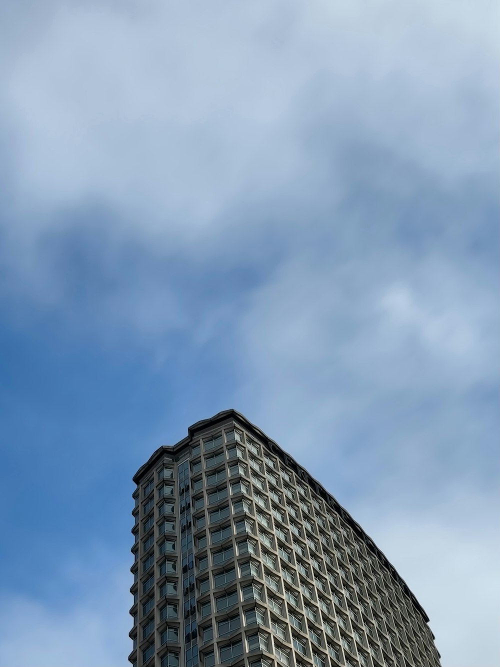 a very tall building with a clock on it's side