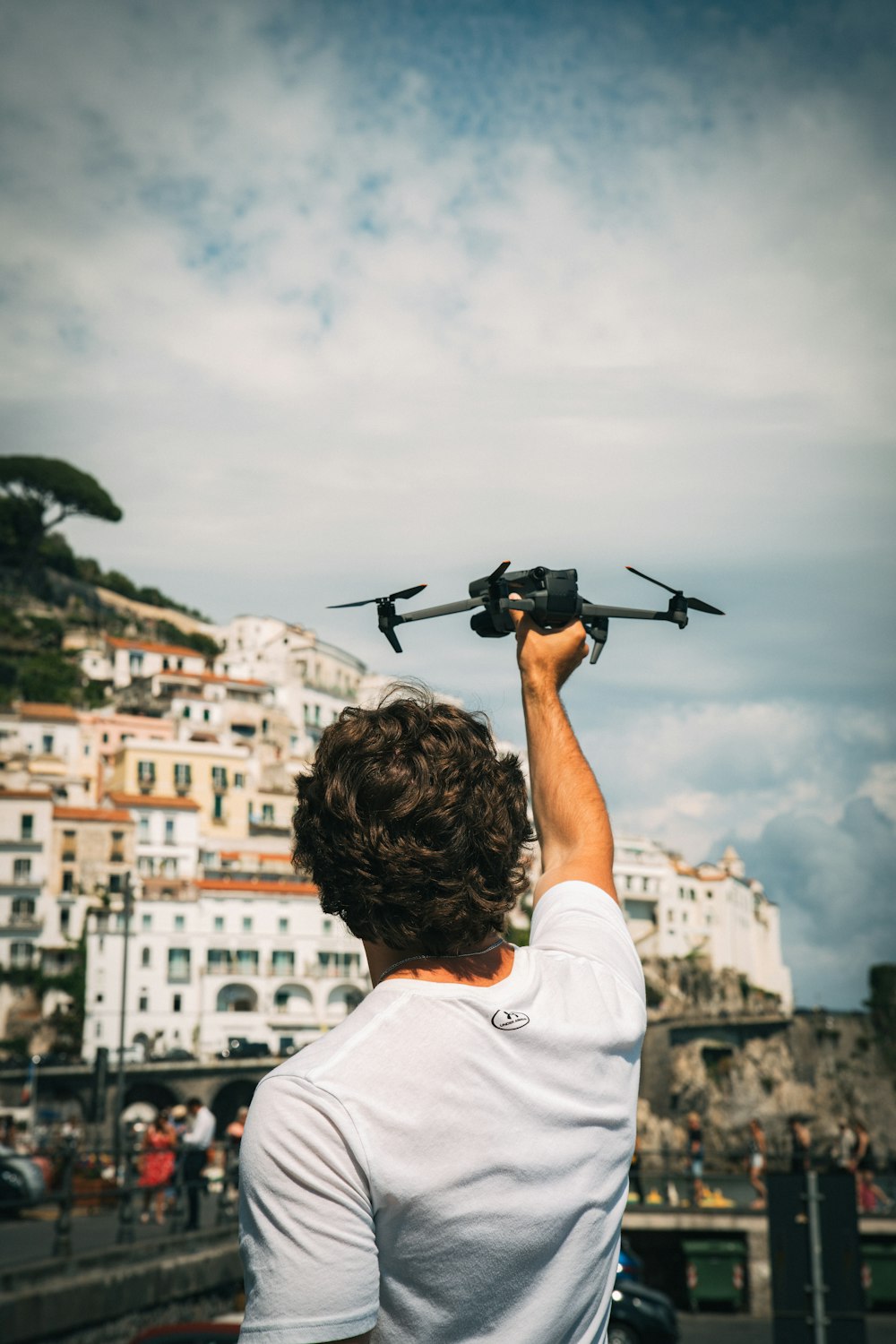 a man holding a remote control plane in his hand