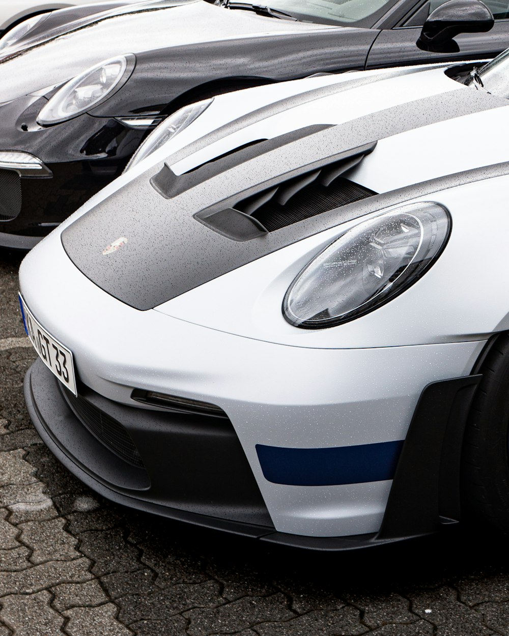 a row of sports cars parked next to each other