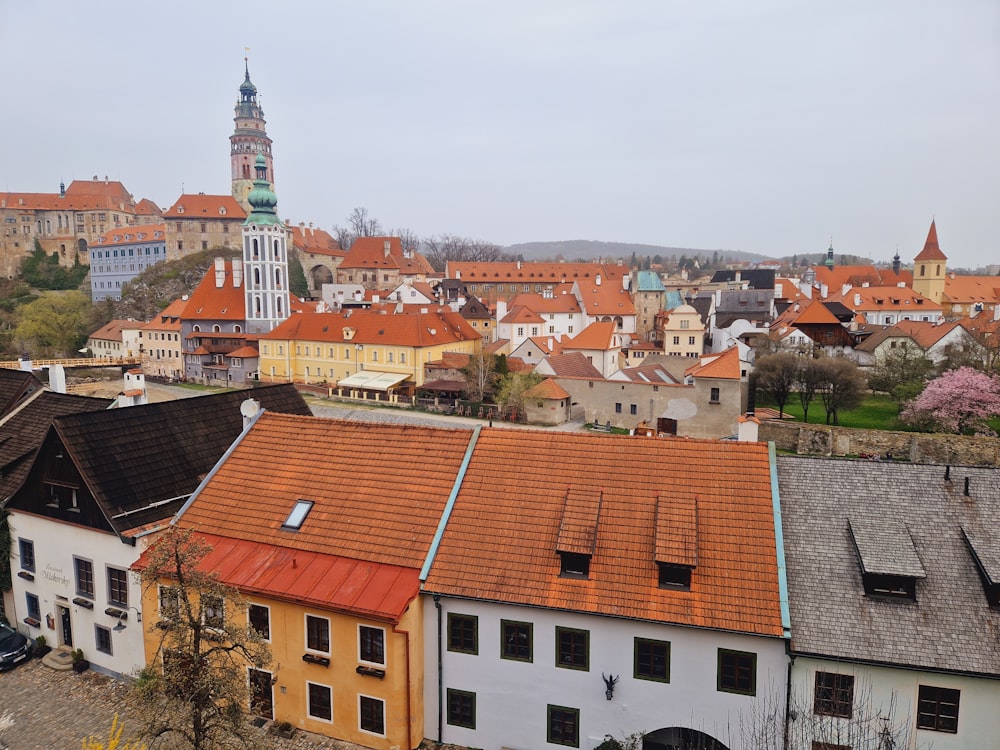 a view of a city with a church tower in the background