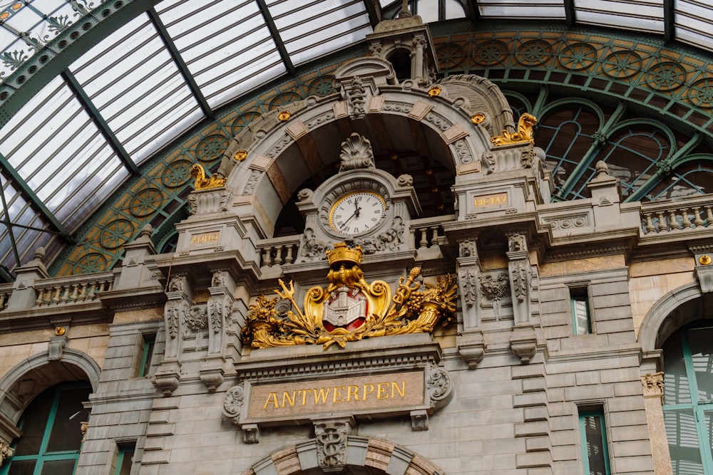 a clock mounted to the side of a building